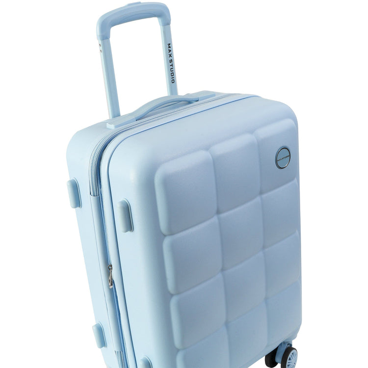 Light blue suitcase with a textured surface on a white background