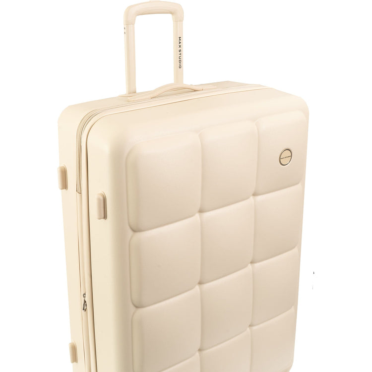 Beige quilted suitcase with handle on a white background