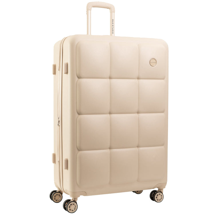 Beige suitcase with a quilted texture on a white background