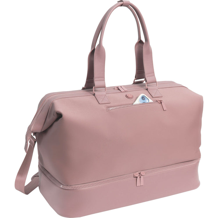Pink duffel bag with a shoulder strap on a white background
