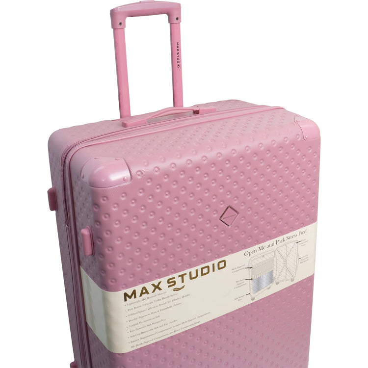 Pink suitcase with 'Max Studio' label on a white background