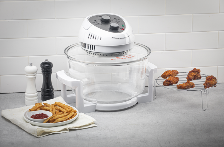 White kitchen appliance with food items on a gray surface and white tiled wall background