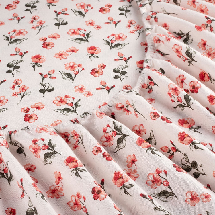 Floral patterned fabric with pink flowers on a white background