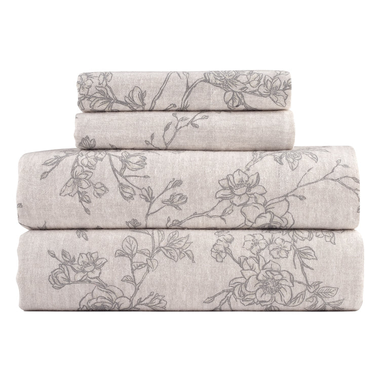 Stack of floral-patterned sheets on a white background