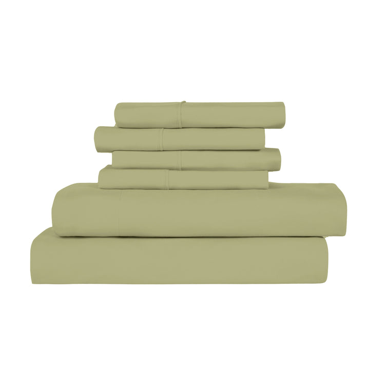 Stack of green bed sheets on a white background