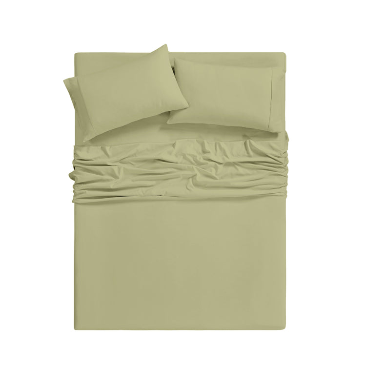 Green bed sheet set with two pillows on a white background