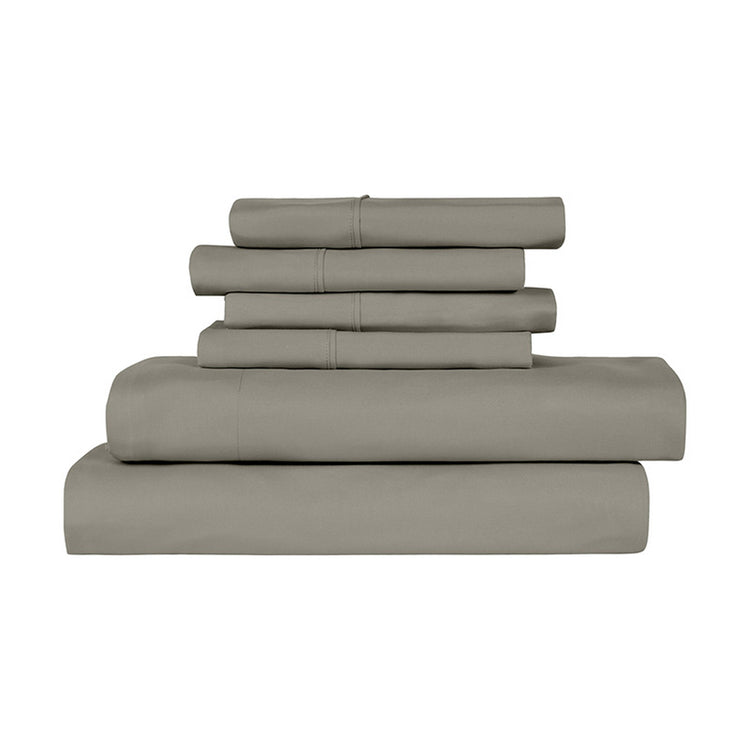 Stack of gray bed sheets on a white background