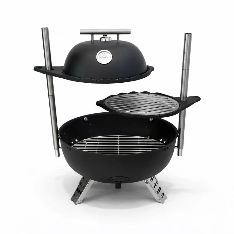 Black barbecue grill with a lid on a white background