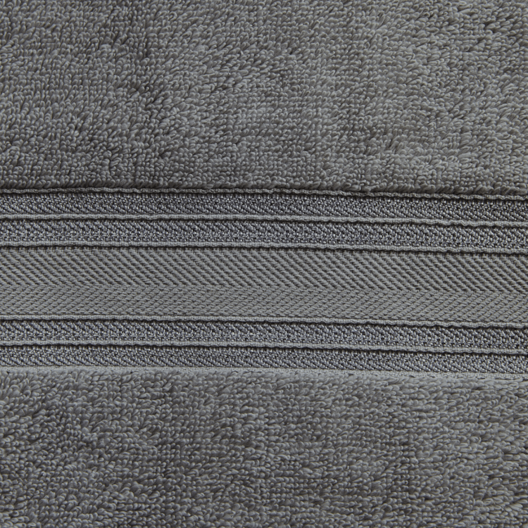 Close-up of gray fabric with a zipper