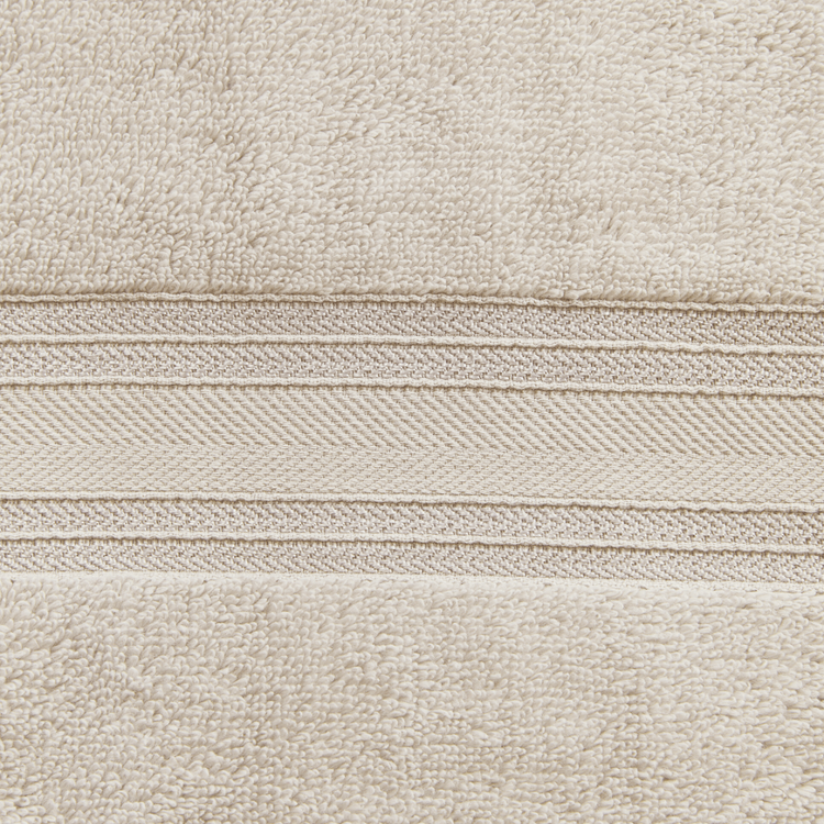 Close-up of beige fabric with a subtle pattern