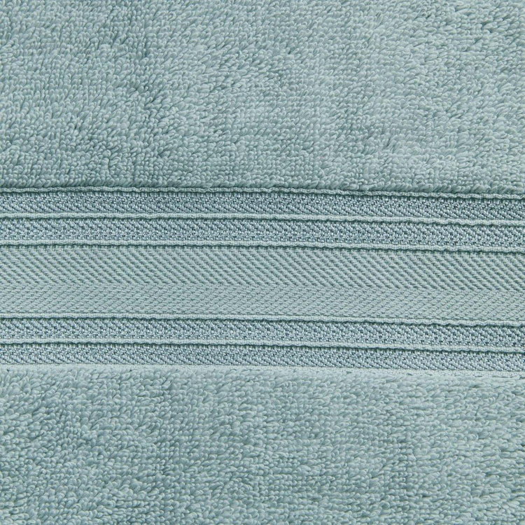 Close-up of a textured teal fabric with a zipper