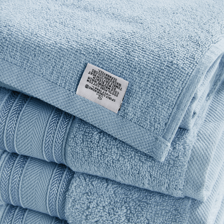 Stack of blue towels with a label on top