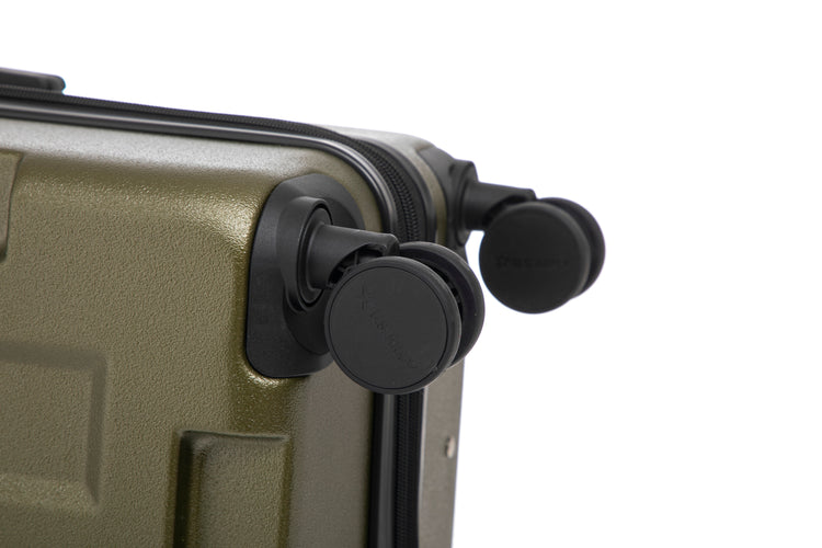Close-up of a green suitcase with black wheels on a white background