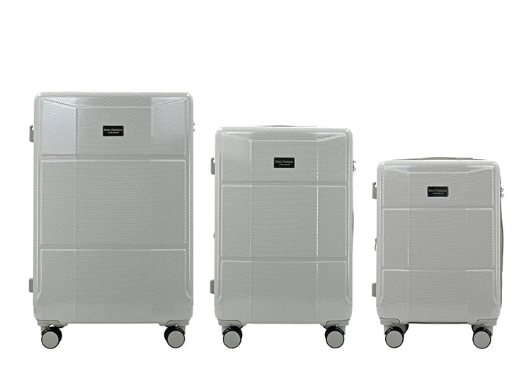 Three gray suitcases of different sizes on a white background