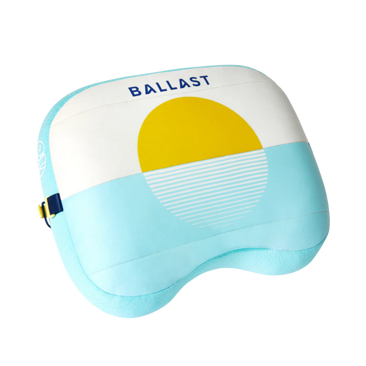Light blue and yellow pillow with 'BALLAST' branding on a white background