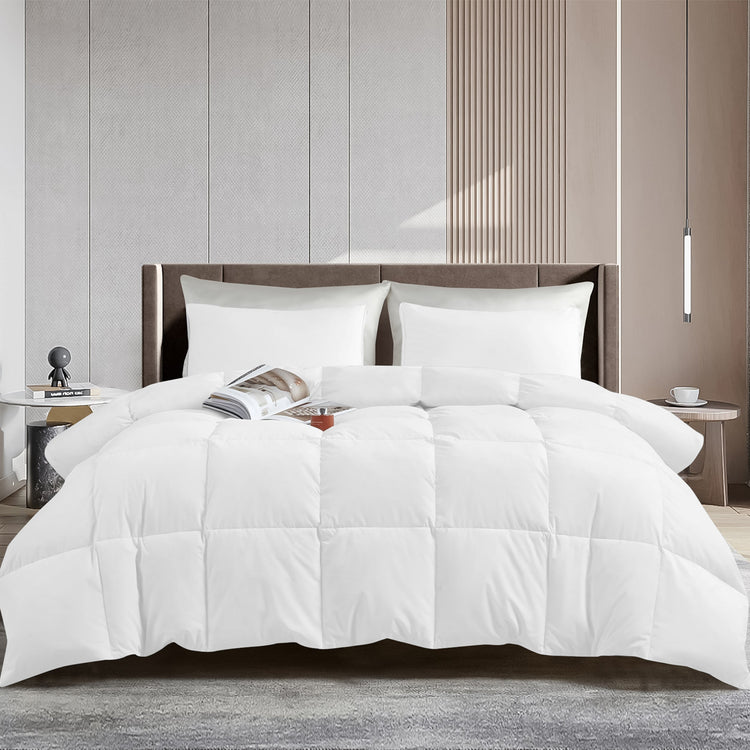 White comforter on a bed in a modern bedroom setting