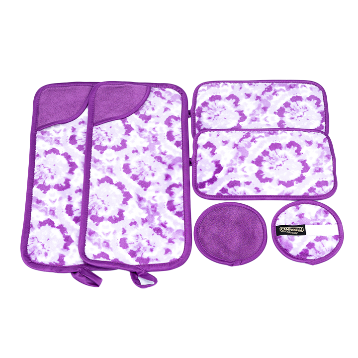A set of blue microfiber makeup remover towels with a paisley pattern, displayed with a small circular product possibly a washcloth or pad included in the set.