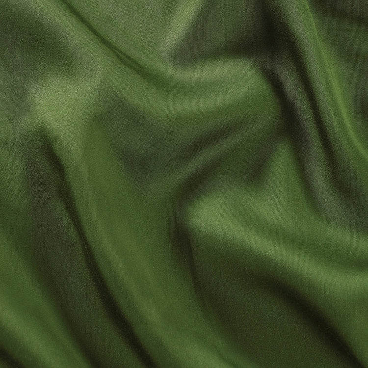 Close-up of green fabric with folds