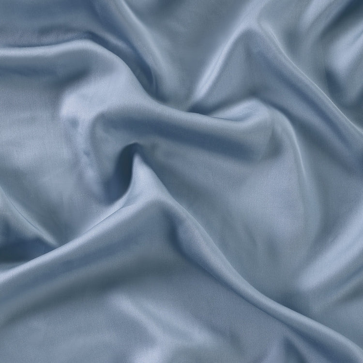 Close-up of blue fabric with folds