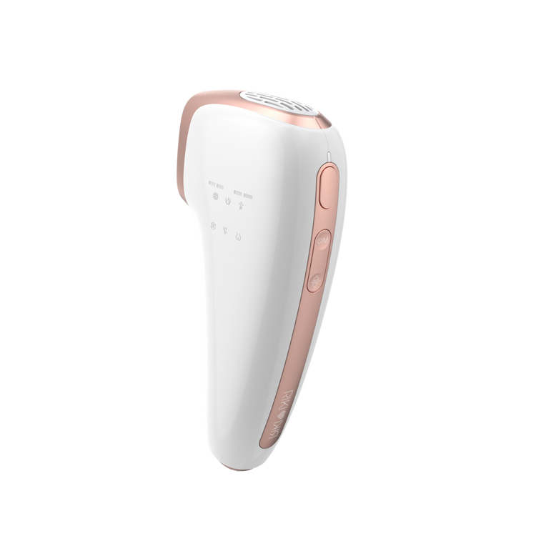 White and rose gold hair removal device on a white background