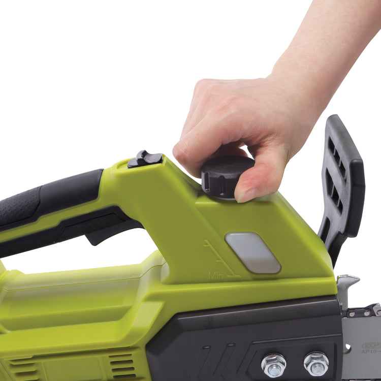 Hand holding a green chainsaw on a white background