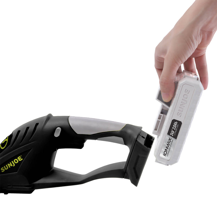 Hand holding a Sun Joe vacuum cleaner battery pack against a white background