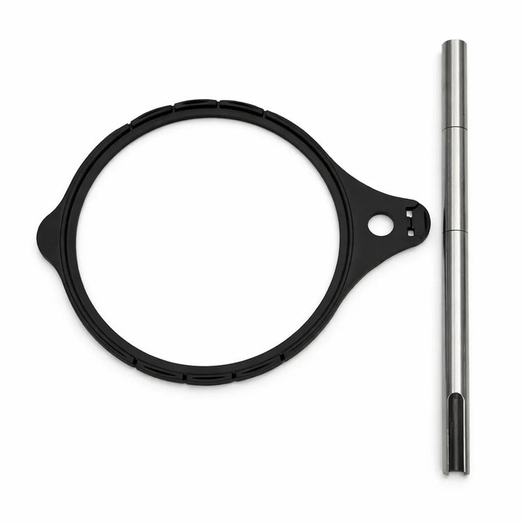Black circular filter and metal rod on a white background