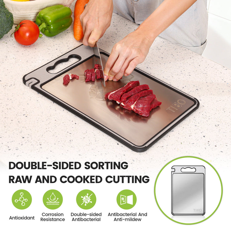 Person cutting meat on a double-sided cutting board with vegetables in the background