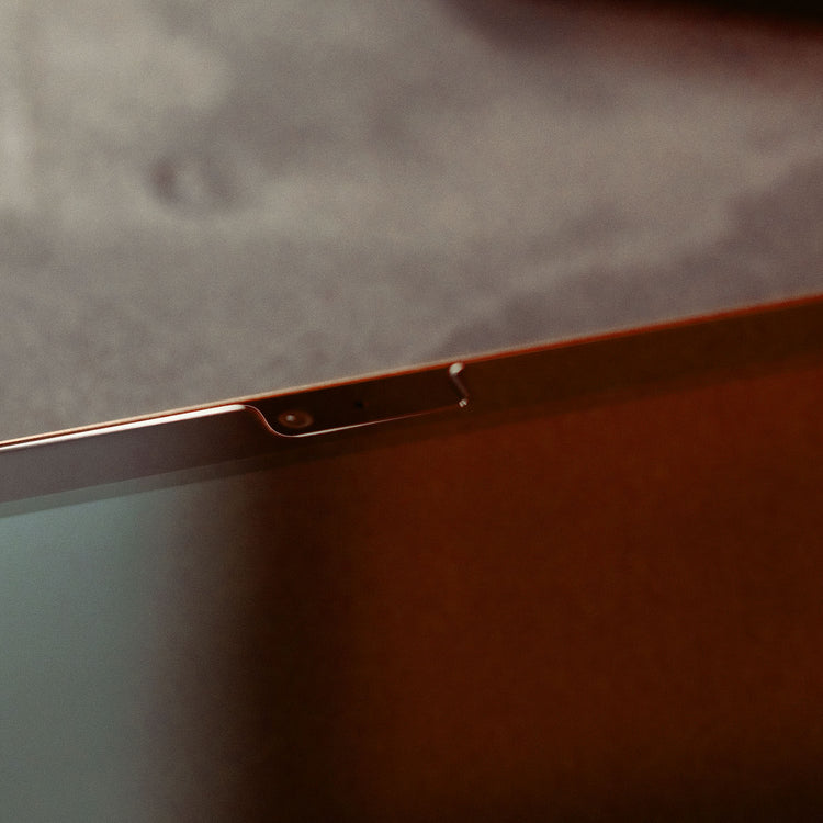 Close-up of a metallic object on a textured surface