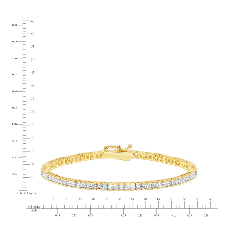 Gold bracelet with diamonds on a white background with measurement scale