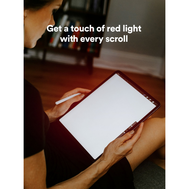 Person using a digital tablet with stylus in a room setting, text overlay 'Get a touch of red light with every scroll'.