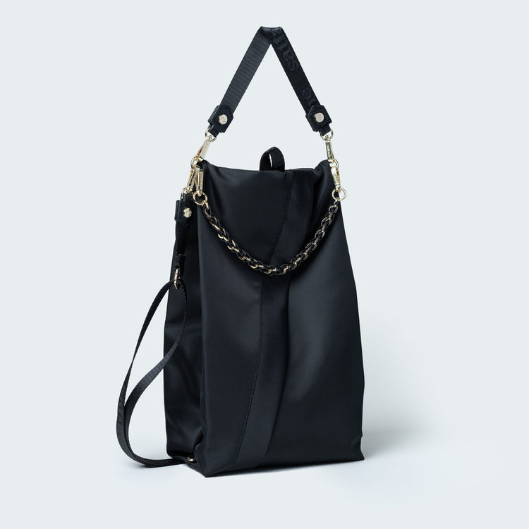 Black handbag with chain detail on a white background
