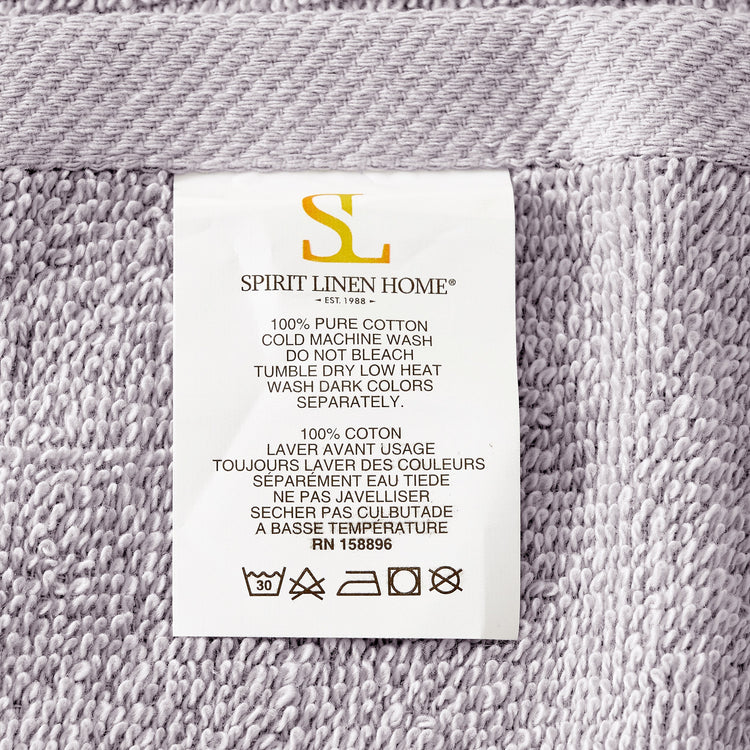 Fabric label with 'Spirit Linen Home' branding on a textured fabric background