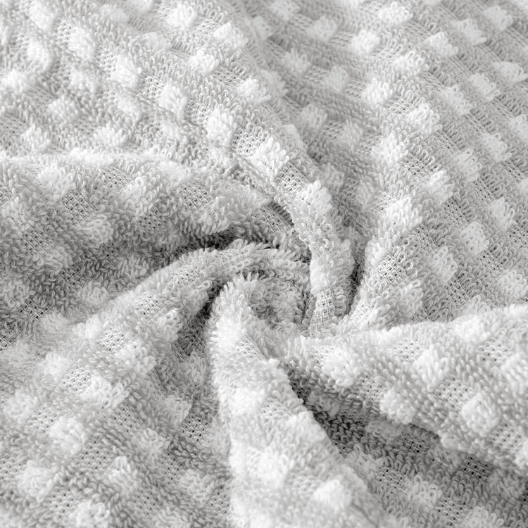 Close-up of textured gray fabric with a wavy pattern