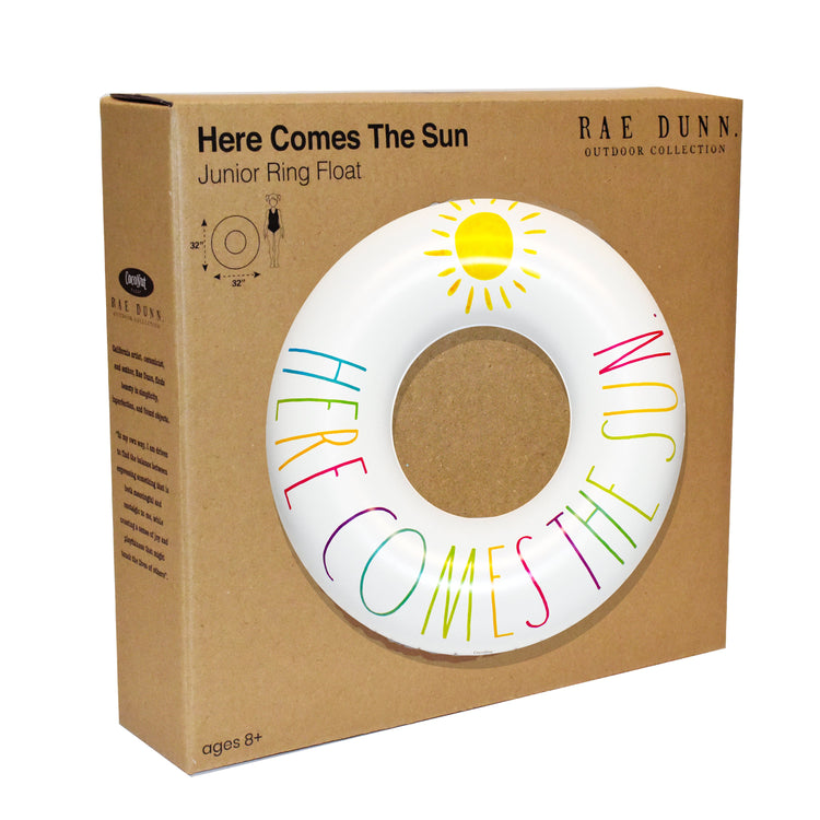 Cardboard packaging of a 'Here Comes The Sun' junior ring float with colorful text and sun design.