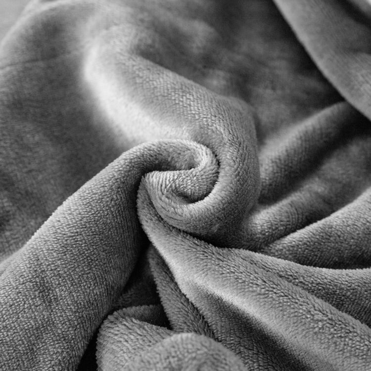 Close-up of textured gray fabric with folds