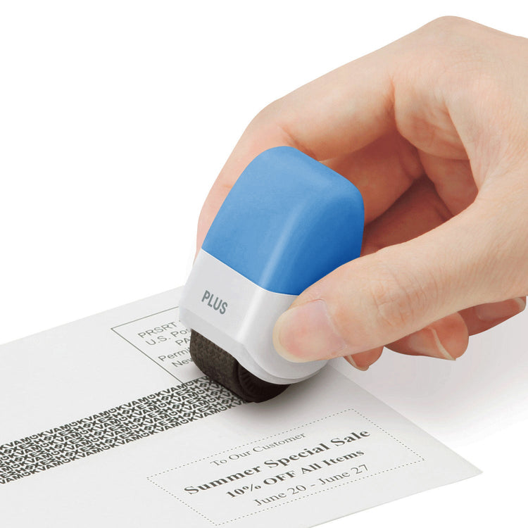 Hand using a blue and white stamp on a document with text and a barcode.