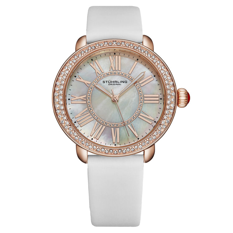 Stuhrling watch with rose gold case and white strap on a white background