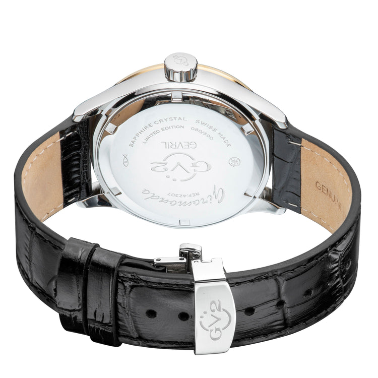 Close-up of a watch with a black leather strap and silver case on a white background