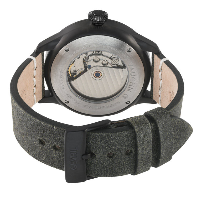 Watch with a textured strap and visible mechanism on a white background