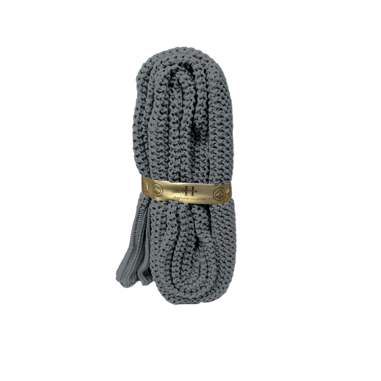 Gray shoelace with a gold label on a white background