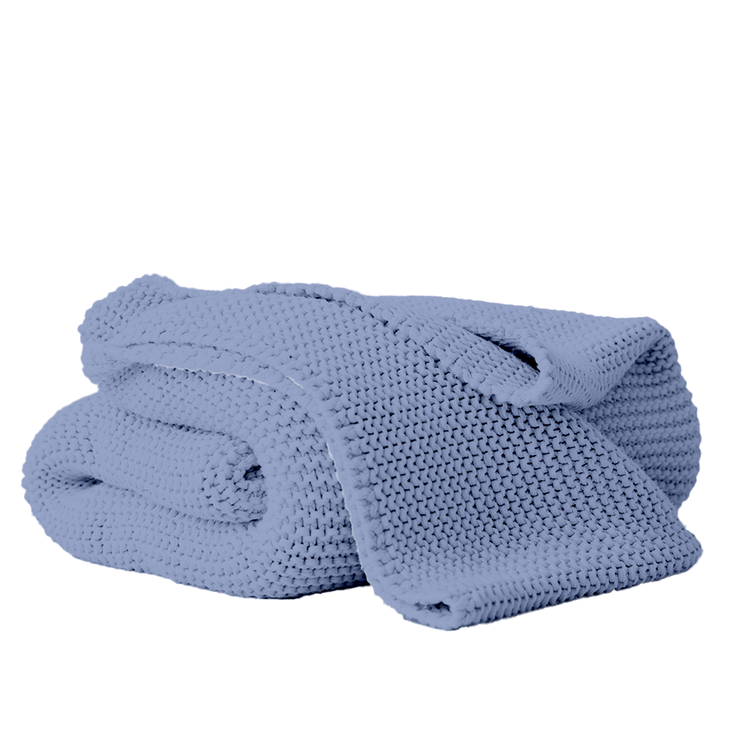 Folded blue towel on a white background