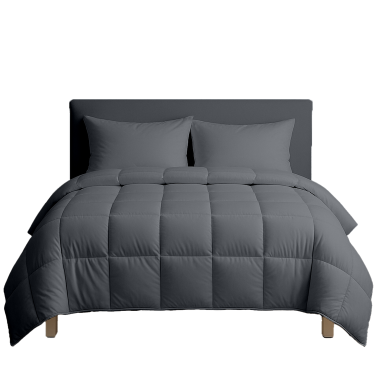 Gray comforter set on a bed with pillows against a white background