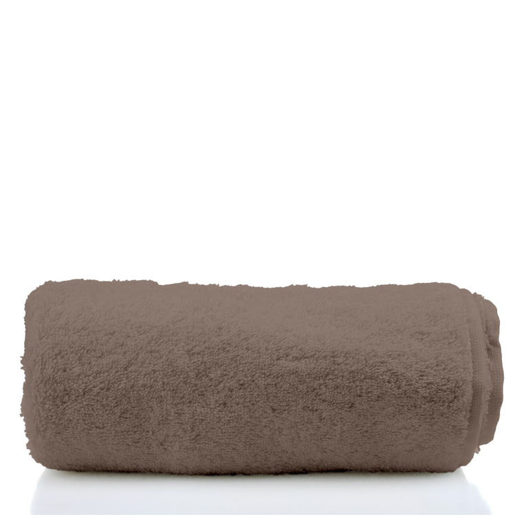Rolled brown towel on a white background