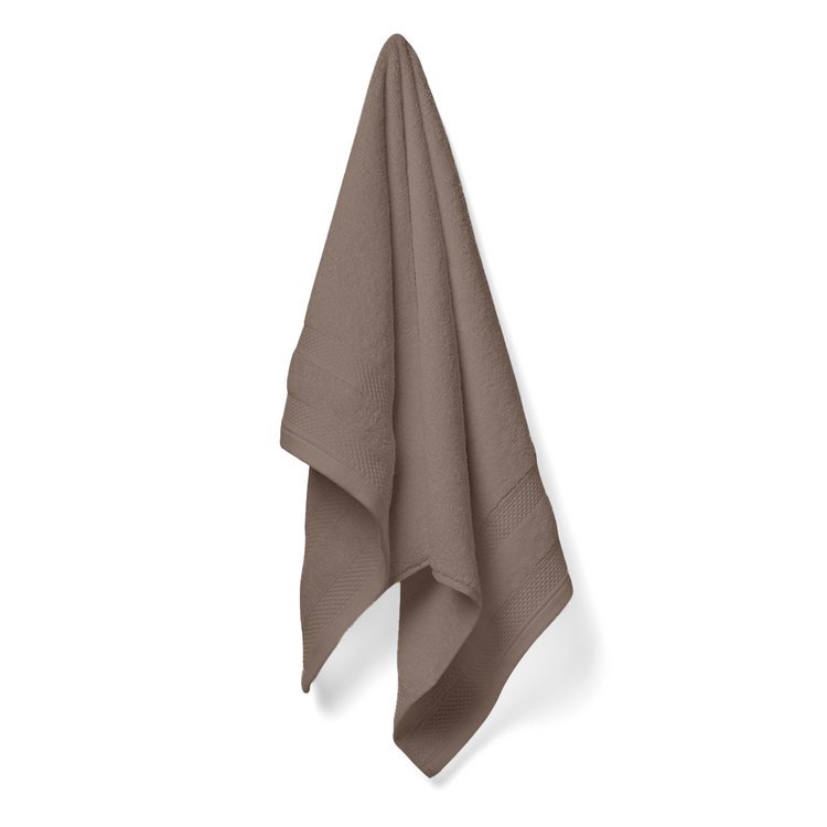 Brown towel hanging on a white background