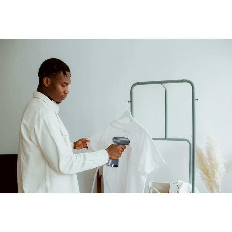 Man ironing a t-shirt