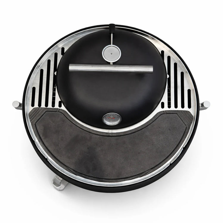 Round black and silver device on a white background