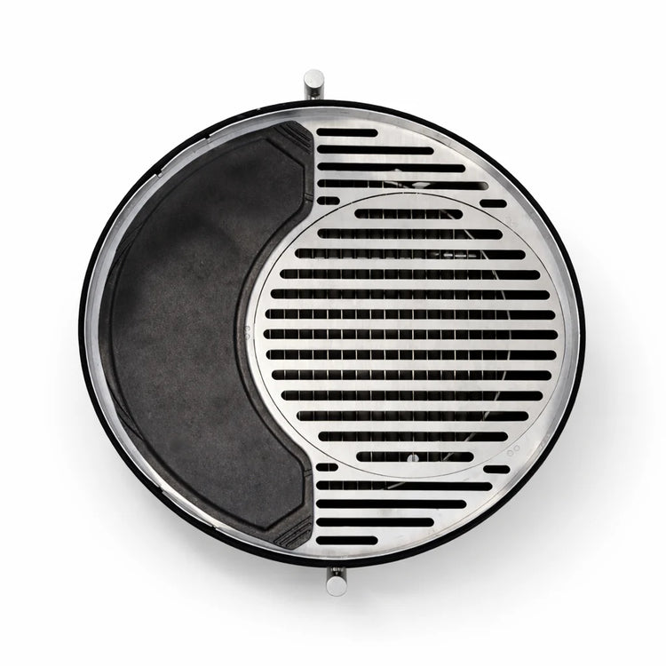 Round metal grill with black interior on a white background
