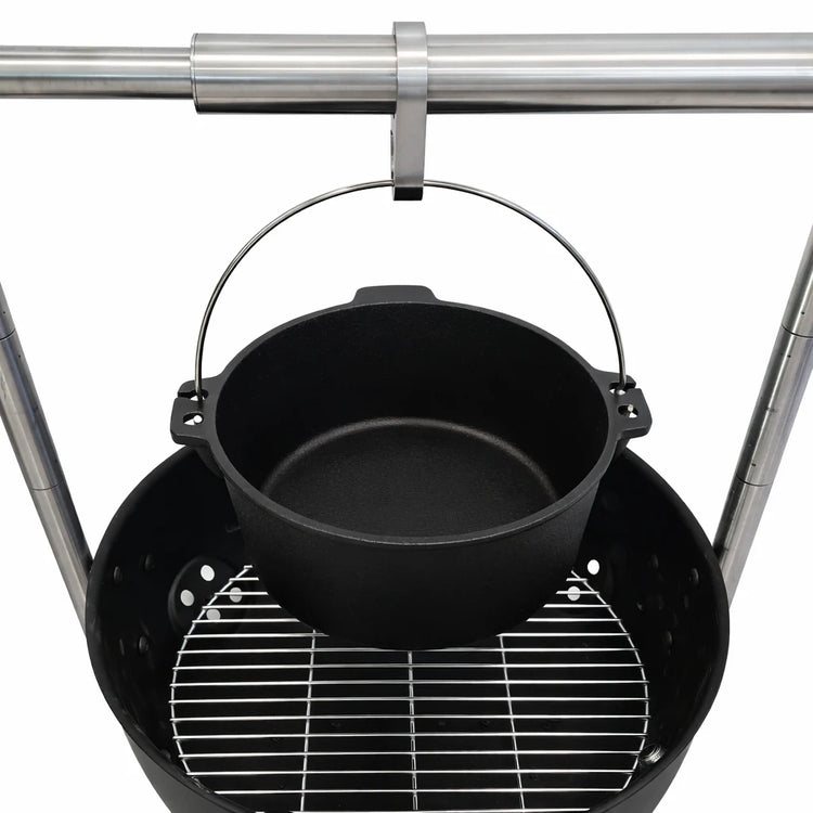 Black pot hanging over a grill with a white background