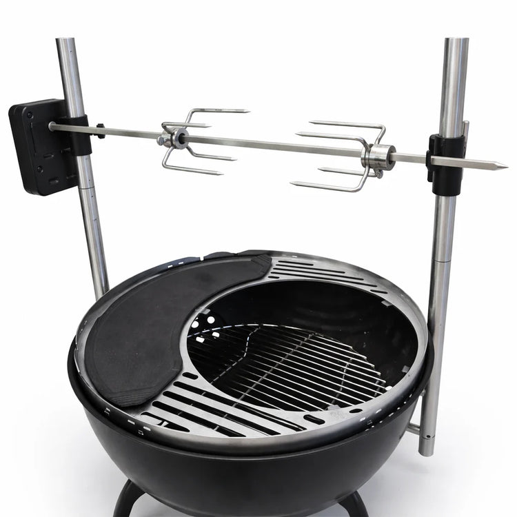 Black grill with rotisserie system on a white background